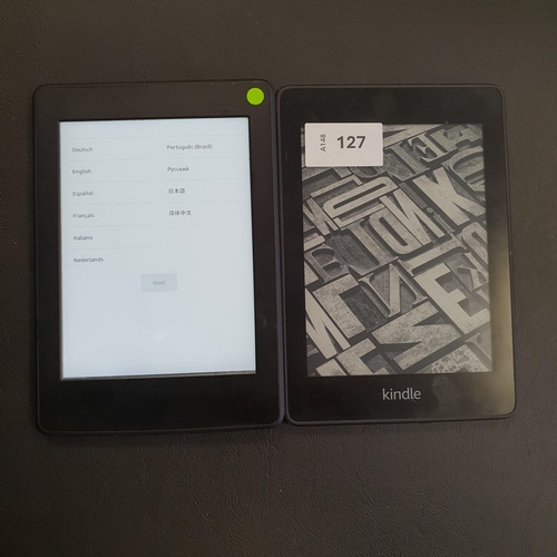 127 - TWO AMAZON KINDLE PAPERWHITE E-READERS
comprising a Paperwhite 4 10th generation, serial number G000... 