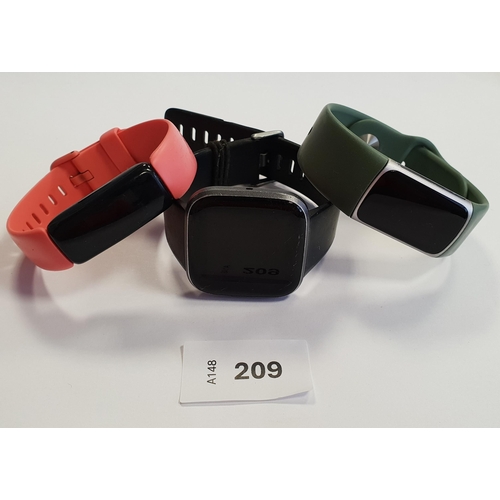 209 - THREE FITBIT FITNESS TRACKERS
comprising a Versa 2, an Inspire 2 and Charge 5