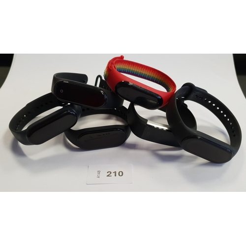 210 - SIX VARIOUS FITNESS TRACKERS