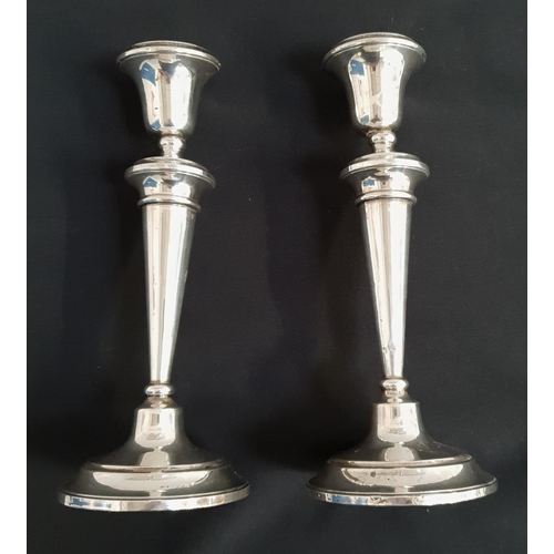 164 - PAIR OF SILVER WEIGHTED CANDLESTICKS
Birmingham hallmarks for 1946, 24cm high (2)