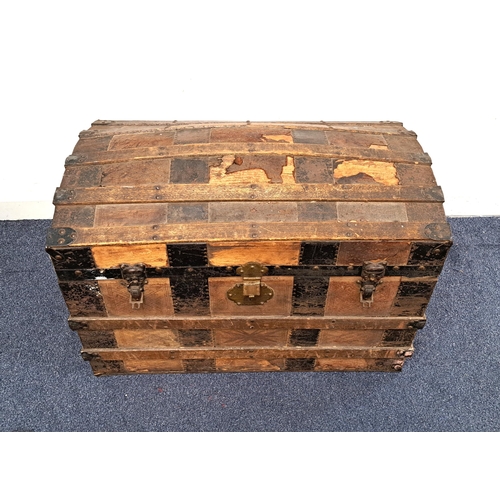 VINTAGE DOMED TOP TRAVEL TRUNK 
with steel bands, the interior with fitted tray, letter holder and various compartments, on castors and in well used condition, 57 x 82 x 48 cm