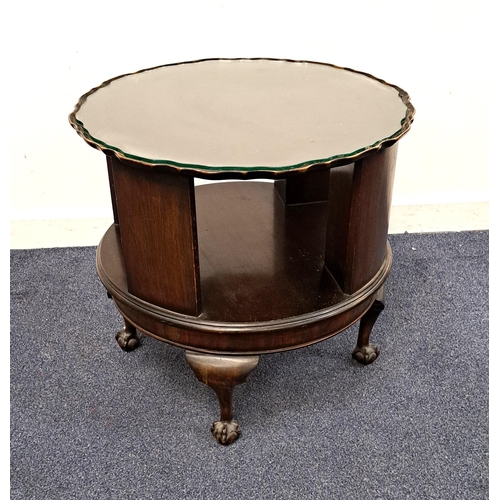 ROTATING BOOKCASE MAHOGANY OCCASIONAL TABLE
with pie crust edge and with open bookcase storage area below, on cabriole legs with claw and ball feet, with glass top protector, 57 x 57 x 62cm