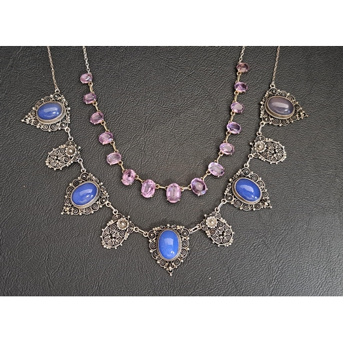 25 - TWO GEM/STONE SET SILVER NECKLACES
one with intricate filigree drops, five of which are set with ova... 