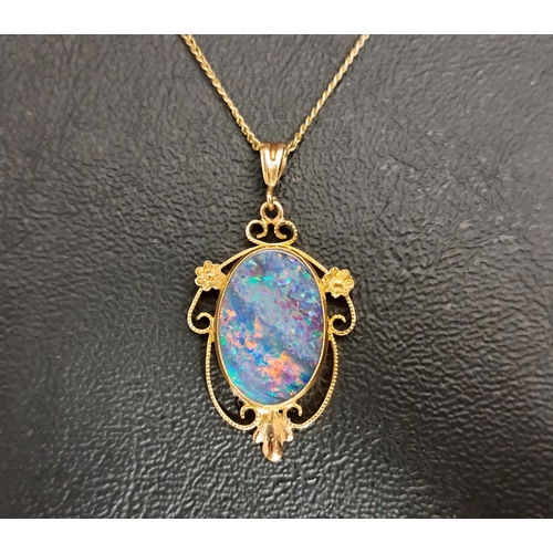 62 - OPAL TRIPLET PENDANT
the oval opal triplet in scroll and floral setting, in nine carat gold and on n... 