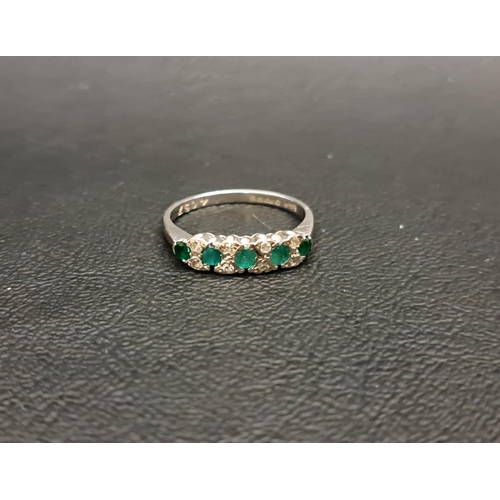 72 - EMERALD AND DIAMOND RING
the five graduated round cut emeralds separated by small diamonds, on eight... 