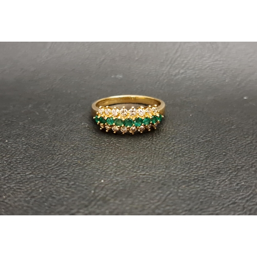 80 - EMERALD AND DIAMOND RING
the central row of nine graduated emeralds with a row of diamonds above and... 