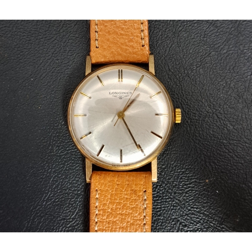 90 - GENTLEMAN'S LONGINES NINE CARAT GOLD CASED WRISTWATCH
1970s, the champagne dial with baton five minu... 