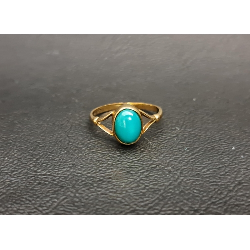 92 - TURQUOISE SINGLE STONE RING
the oval cabochon turquoise stone on nine carat gold shank with decorati... 