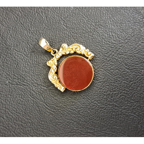 93 - NINE CARAT GOLD MOUNTED SWIVEL FOB
one side bloodstone, the other carnelian