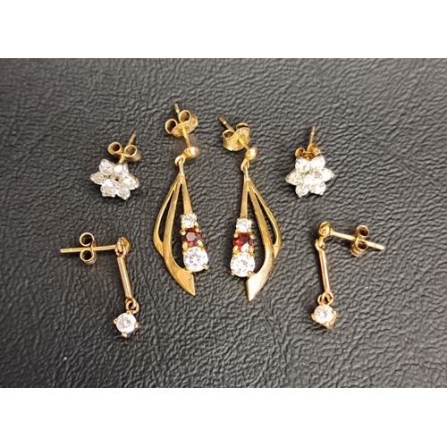 97 - THREE PAIRS OF CZ SET EARRINGS
all in gold, the single stone drops earrings in unmarked gold and the... 