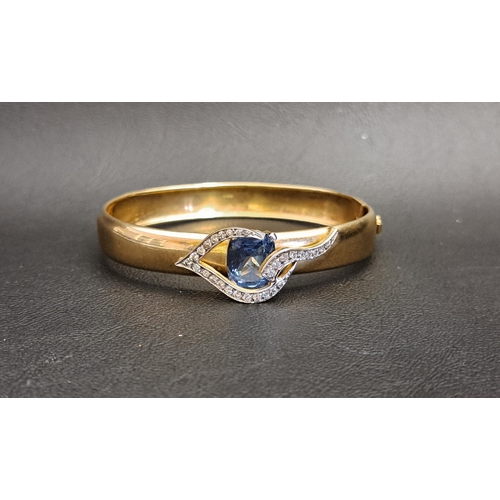 106 - UNUSUAL BLUE TOPAZ AND CLEAR GEM SET NINE CARAT GOLD BANGLE
the cushion cut blue topaz measuring app... 