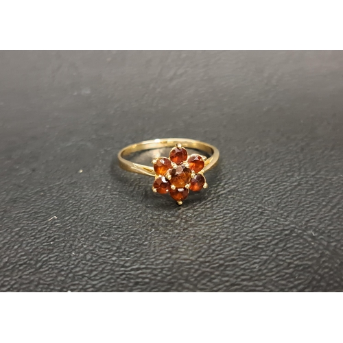 116 - GARNET CLUSTER RING
on unmarked gold shank, ring size L