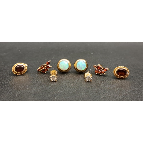 138 - FOUR PAIRS OF GEM SET GOLD STUD EARRINGS
comprising a pair of illusion set diamond stud earrings in ... 