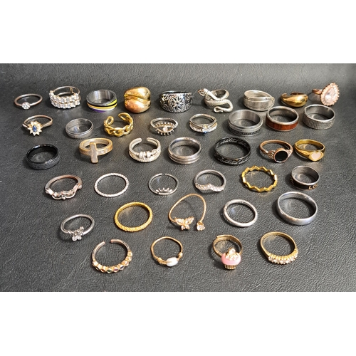 101 - SELECTION OF SILVER AND OTHER RINGS
including larger statement rings and stone and enamel set exampl... 