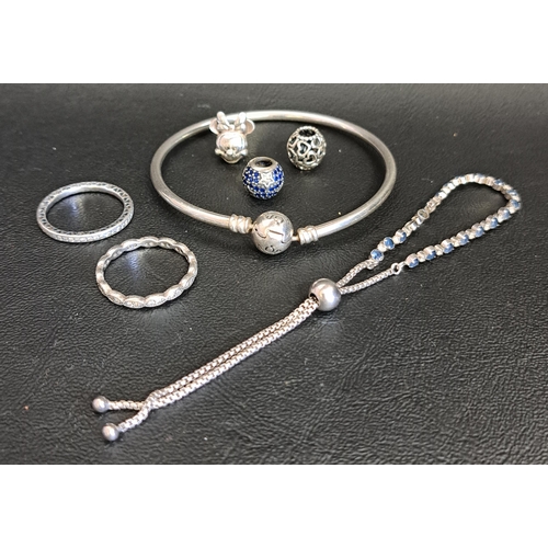 156 - SELECTION OF PANDORA SILVER JEWELLERY 
comprising a slider bracelet, two rings - Sparkle & Hearts et... 