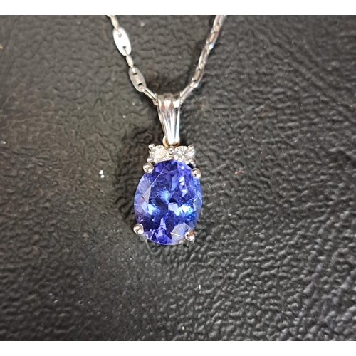 69 - TANZANITE AND DIAMOND PENDANT
the oval cut tanzanite approximately 1.5cts below two small diamonds t... 