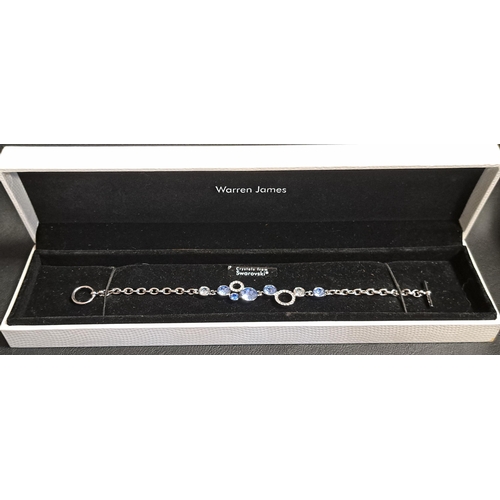 127 - WARREN JAMES SWAROVSKI CRYSTAL BRACELET
with blue and white stones, in box