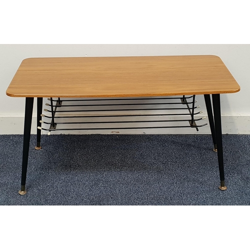 428 - MID CENTURY ATOMIC STYLE COFFEE TABLE
with Melamine top and black magazine rack below, the black tap... 