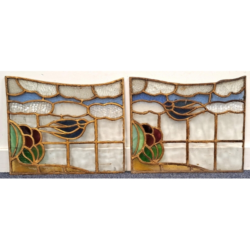 461 - PAIR OF GLASGOW SCHOOL STAINED GLASS COPPER LEADED PANELS
depicting swallow with foliage, sky and cl... 