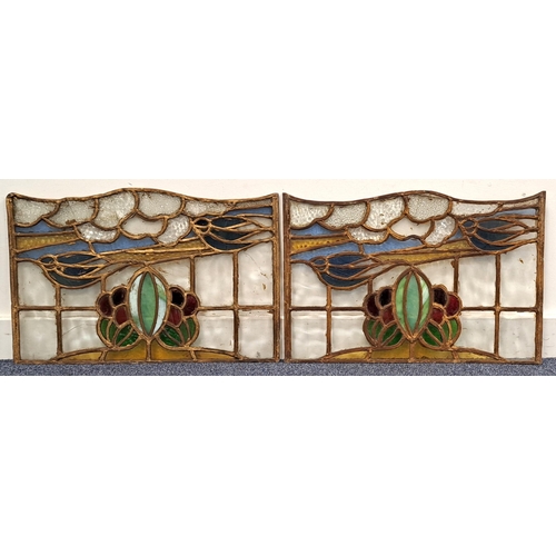 462 - PAIR OF GLASGOW SCHOOL STAINED GLASS COPPER LEADED PANELS
depicting swallows with foliage, sky and c... 