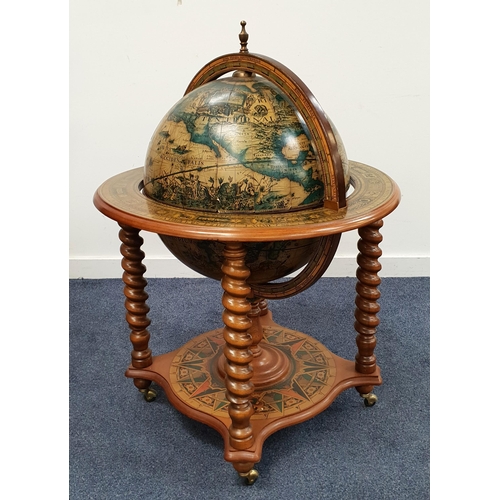 474 - A 20th CENTURY DRINKS GLOBE
with a hinged lid enclosing a fitted interior, raised on spiral outer su... 