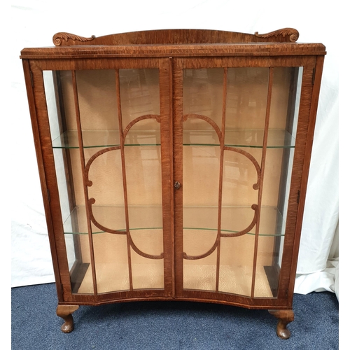 468 - ART DECO OAK CONCAVE FRONTED GLASS DISPLAY/ GLAZED BOOKCASE 
with quatrefoil design and two glass sh... 