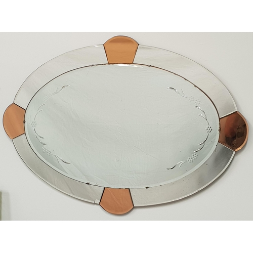 450 - LARGE OVAL ART DECO OVERMANTLE MIRROR
with copper colour segments and over mirror with grape and fol... 