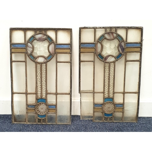 464 - PAIR OF ART AND CRAFTS STAINED GLASS LEADED PANELS
with geometric circle and blue and yellow design,... 