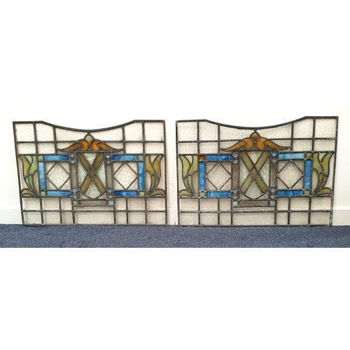 465 - PAIR OF ARTS AND CRAFTS STAINED GLASS LEADED PANEL
depicting colourful geometric and foliate design ... 