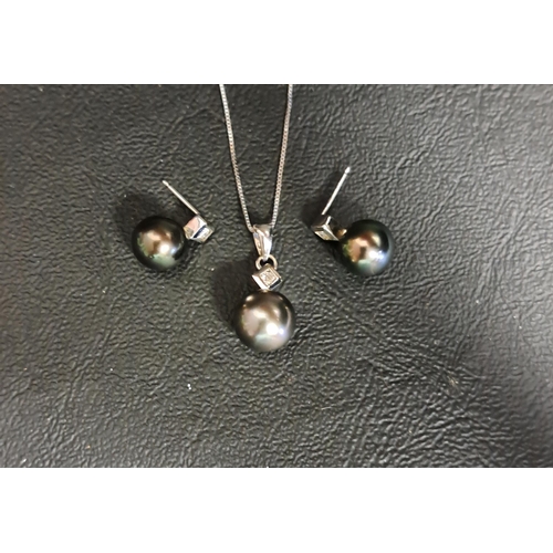 58 - BLACK PEARL AND DIAMOND SUITE OF JEWELLERY
comprising a pendant on chain and a pair of earrings, eac... 