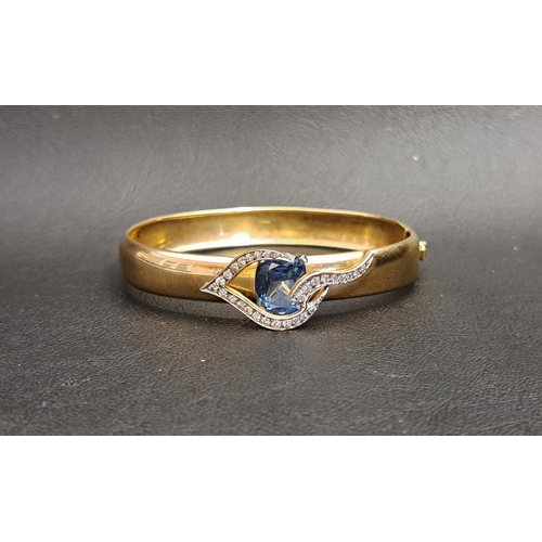 106 - UNUSUAL BLUE TOPAZ AND CLEAR GEM SET NINE CARAT GOLD BANGLE
the cushion cut blue topaz measuring app... 