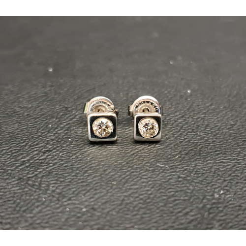 115 - PAIR OF DIAMOND STUD EARRINGS
each of the flush set round brilliant cut diamonds approximately 0.15c... 