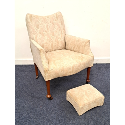 400 - EDWARDIAN MAHOGANY ARM CHAIR
the front legs with pad feet on brown castors, with matching footstool,... 