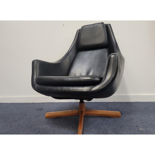 538 - MID CENTURY BLACK LEATHER EFFECT EGG CHAIR
the shaped chair with padded seat and raised on teak swiv... 