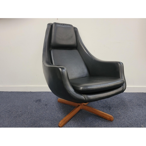 539 - MID CENTURY BLACK LEATHER EFFECT EGG CHAIR
the shaped chair with padded seat and raised on teak swiv... 