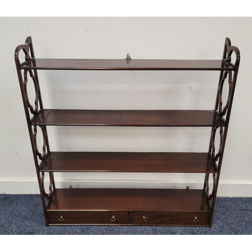 534 - MAHOGANY WALL MOUNTING SHELF UNIT
the four shelves above two drawers and flanked by pierced sides, 8... 