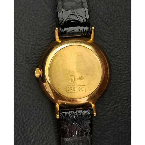 22 - LADIES NINE CARAT GOLD CASED EVERITE WRISTWATCH
the circular dial with baton five minute markers