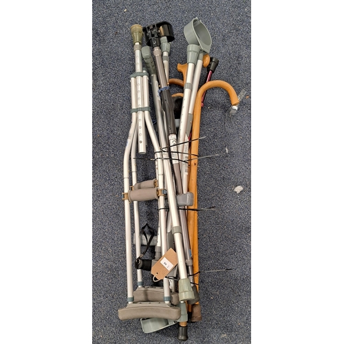 44 - SELECTION OF ELEVEN WALKING STICKS AND WALKING AIDS