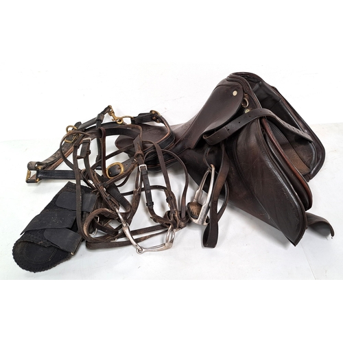 429 - LEATHER HORSE SADDLE 
numbered N77 underneath, together with a bridle, head collar and a pair of boo... 