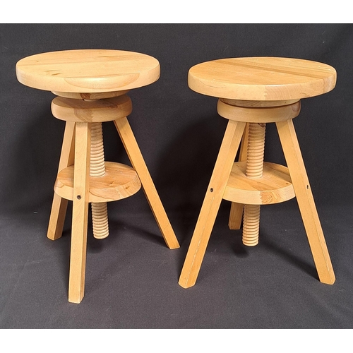 544 - PAIR OF PINE ADJUSTABLE CRASFTSMAN'S STOOLS
with tripod legs and wooden screw mechanism, 32cm diamet... 