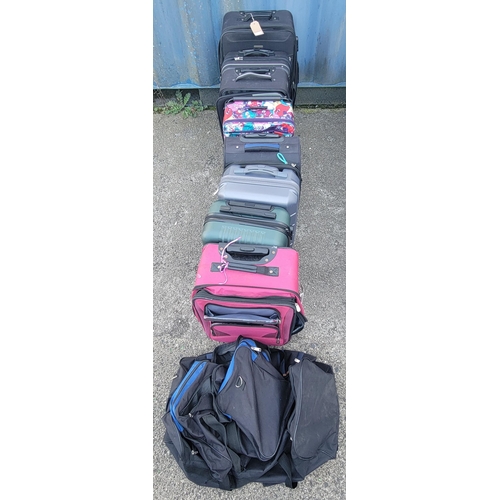 6 - SELECTION OF EIGHT SUITCASES AND TWO HOLDALLS 
including: IT, Moos, BL, Ricardo
Note: Suitcases and ... 