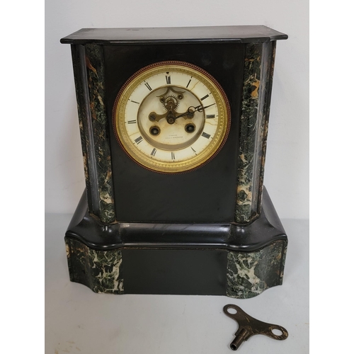 330 - A VICTORIAN SLATE AND MARBLE MANTEL CLOCK BY SIMMONS A PARIS & MANCHESTER
with black slate body and ... 