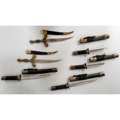 331 - SIX DECORATIVE KUTANA STYLE AND ARABIAN DAGGER STYLE LETTER OPENERS
the Kutana style with leather co... 