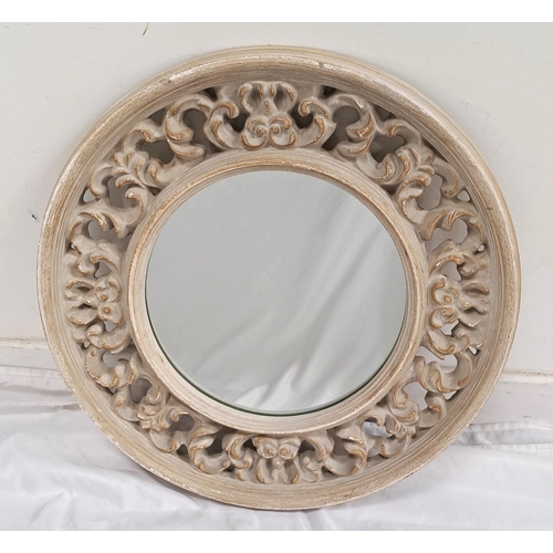 556 - ROUND CREAM CONTEMPORARY WALL MIRROR
with ornate carved frame, 49cm diameter