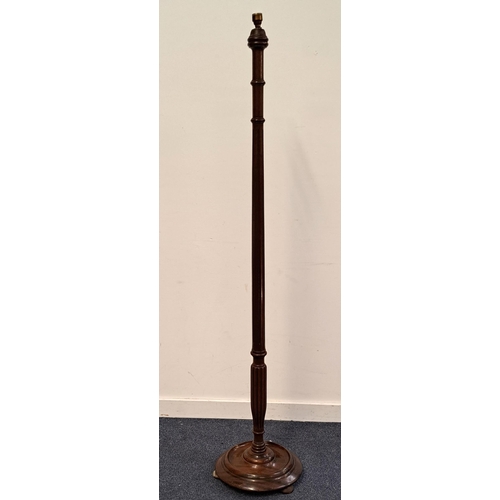 596 - MAHOGANY STANDARD LAMP, 
with fluted column and turned base on ball feet, 151cm high excluding light... 