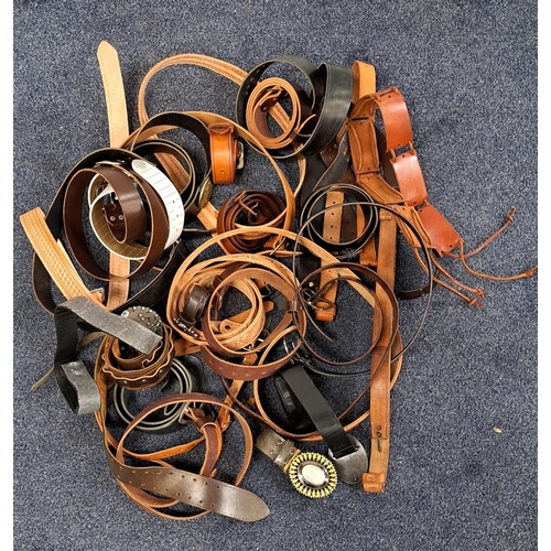 378 - LARGE SELECTION OF HANDMADE LEATHER BELTS
some with tooled decoration and decorative buckles, compri... 