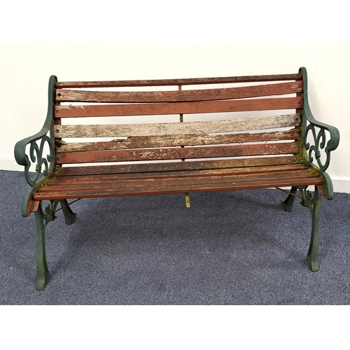 601 - CAST IRON GARDEN BENCH WITH TABLE
the ends with scroll work painted green, the bench 130 x 74 x 64cm... 