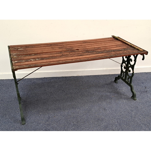 601 - CAST IRON GARDEN BENCH WITH TABLE
the ends with scroll work painted green, the bench 130 x 74 x 64cm... 