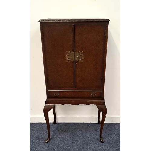 606 - QUEEN ANNE STYLE DRINKS CABINET BY CAMEO
with Burr Walnut veneer and ornate plate lock on two doors,... 