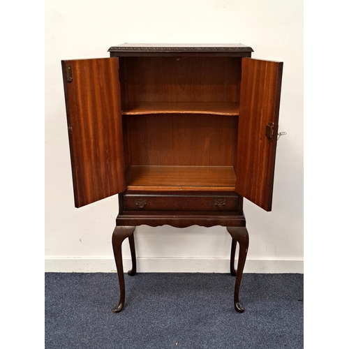 606 - QUEEN ANNE STYLE DRINKS CABINET BY CAMEO
with Burr Walnut veneer and ornate plate lock on two doors,... 